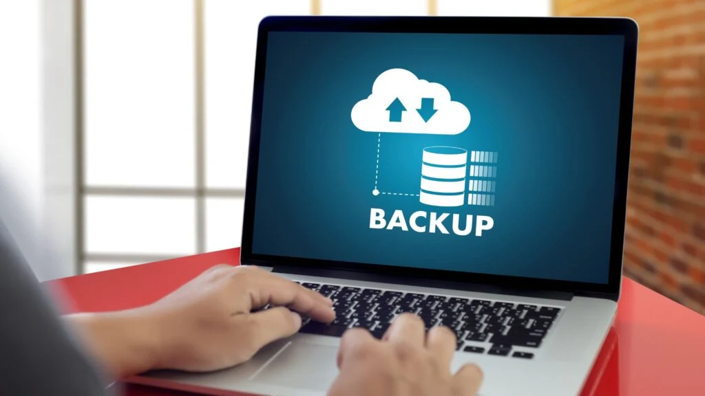 man doing a backup in his laptop